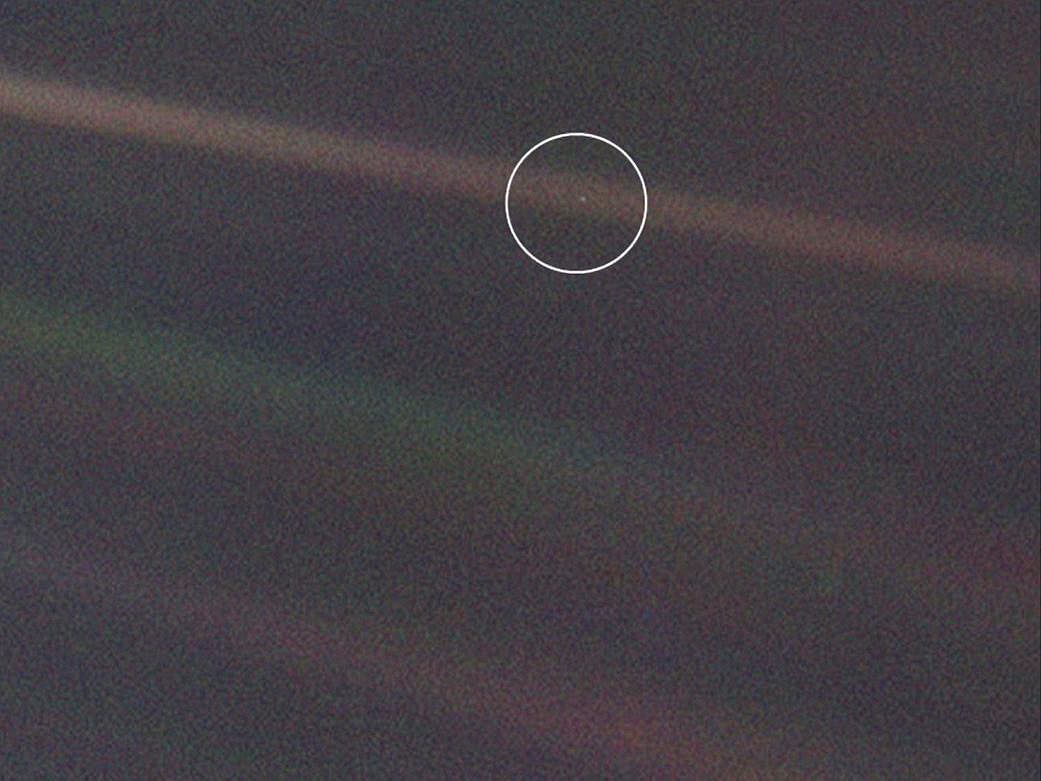 “Look again at that dot. That’s here. That’s home. That’s us. On it everyone you love, everyone you know, everyone you ever heard of, every human being who ever was, lived out their lives. The aggregate of our joy and suffering, thousands of confident religions, ideologies, and economic doctrines, every hunter and forager, every hero and coward, every creator and destroyer of civilization, every king and peasant, every young couple in love, every mother and father, hopeful child, inventor and explorer, every teacher of morals, every corrupt politician, every “superstar,” every “supreme leader,” every saint and sinner in the history of our species lived there-on a mote of dust suspended in a sunbeam.

The Earth is a very small stage in a vast cosmic arena. Think of the endless cruelties visited by the inhabitants of one corner of this pixel on the scarcely distinguishable inhabitants of some other corner, how frequent their misunderstandings, how eager they are to kill one another, how fervent their hatreds. Think of the rivers of blood spilled by all those generals and emperors so that, in glory and triumph, they could become the momentary masters of a fraction of a dot.

Our posturings, our imagined self-importance, the delusion that we have some privileged position in the Universe, are challenged by this point of pale light. Our planet is a lonely speck in the great enveloping cosmic dark. In our obscurity, in all this vastness, there is no hint that help will come from elsewhere to save us from ourselves.

The Earth is the only world known so far to harbor life. There is nowhere else, at least in the near future, to which our species could migrate. Visit, yes. Settle, not yet. Like it or not, for the moment the Earth is where we make our stand.

It has been said that astronomy is a humbling and character-building experience. There is perhaps no better demonstration of the folly of human conceits than this distant image of our tiny world. To me, it underscores our responsibility to deal more kindly with one another, and to preserve and cherish the pale blue dot, the only home we’ve ever known.” ~ Carl Sagan, Pale Blue Dot | ?: @nasa Voyager 1